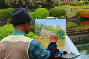 man painting tress